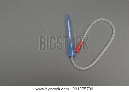 A Device For Extracting Snot A Baby On A Gray Background