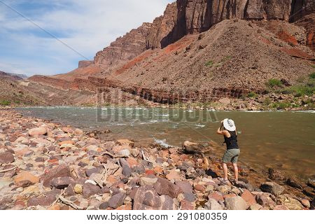 Woman Photographing The Colorado River And The Inner Canyon At Hance Rapids In Grand Canyon National