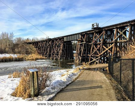 Walking Along A Pathway Beside The Sturgeon River In St. Albert, Alberta, Canada.  The Snow And Ice 