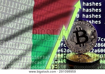 Madagascar Flag And Rising Green Arrow On Bitcoin Mining Screen And Two Physical Golden Bitcoins