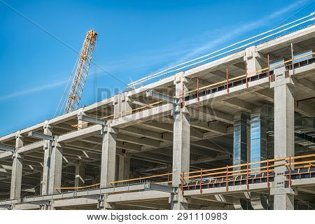 Concrete Bulding In Construction And Yellow Crane