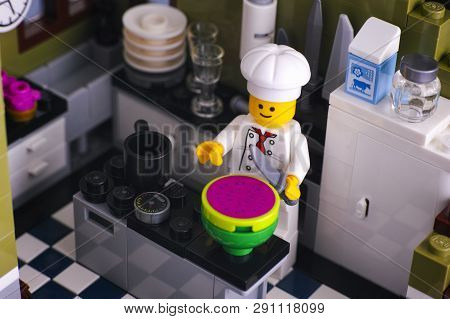 Tambov, Russian Federation - January 04, 2018 Lego Chef Cutting Watermelon In The Kitchen. Studio Sh