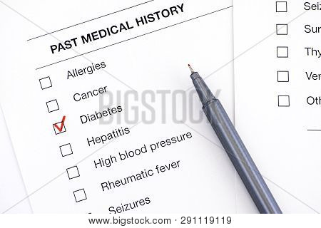 Past Medical History Questionary With Ticked Diabetes And Pen. Close-up.