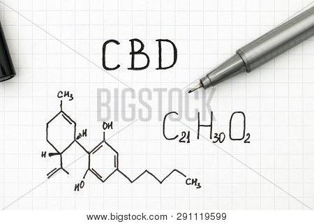 Chemical Formula Of Cannabidiol (cbd) With Black Pen. Closeup.