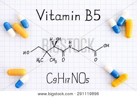 Chemical Formula Of Vitamin B5 And Some Pills. Close-up.