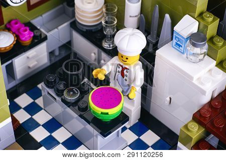 Tambov, Russian Federation - January 04, 2018 Lego Chef Cutting Watermelon In His Kitchen. Studio Sh