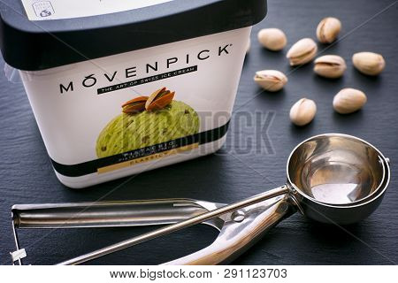 Tambov, Russian Federation - August 30, 2018 Movenpick Pistachio Ice Cream Box With Spoon And Pistac