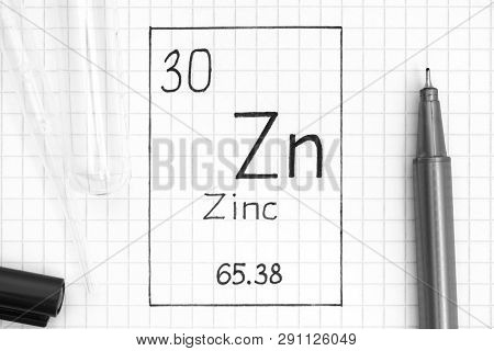 The Periodic Table Of Elements. Handwriting Chemical Element Zinc Zn With Black Pen, Test Tube And P