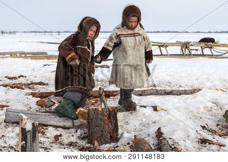 Nadym, Russia - April 27, 2018: Tundra, Open Area, The Boys In National Clothes In Cold Winter Weath
