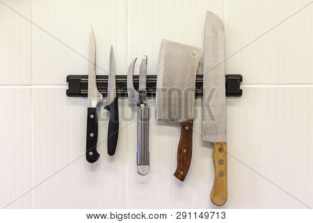 Kitchen Tools, Different Knives On The Magnetic Strip, On The Wall, Set Of Knives On Magnetic Holder