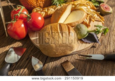 Smoked Cheese Pigtail, Traditional Polish Smoked Cheese, Chechil Cheese On The Wood Background. Smok