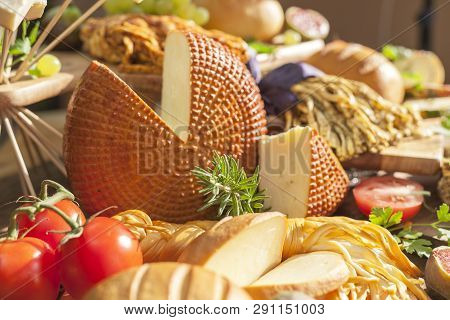 Smoked Cheese Pigtail, Traditional Polish Smoked Cheese, Chechil Cheese On The Wood Background. Smok