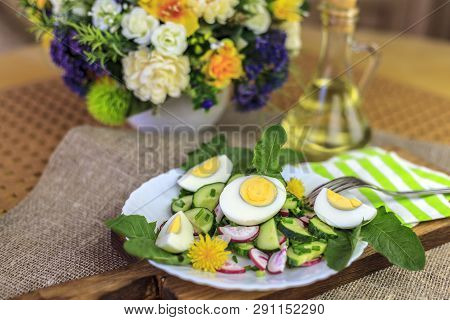 Salad Of Dandelions, Healthy Spring Salad Of Young Leaves Of Dandelion, Cucumber, Radish And Egg On