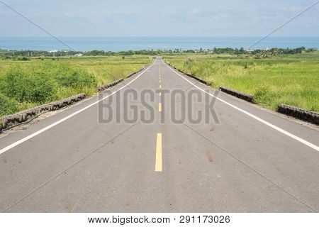 road at green paddy farm in the countryside