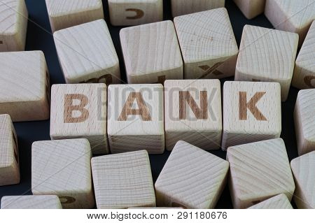 Banking, Financail And Money Concept By Cube Wooden Block With Alphabet Building The Word Bank At Th