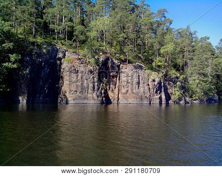 Mighty Trees Grow Along The Shores Of Valaam Island. The Wonderful Island Valaam Is Located On Lake 