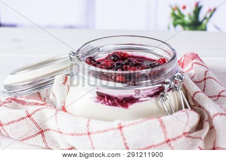 Recipe Step By Step No Bake Cheesecake In A Jar Enwrapped In A Towel In A White Kitchen With Flowers