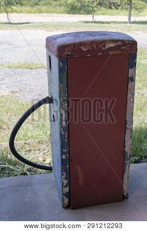 A Close Up View Of The Back Of A Old White, Blue, Red And Black Antique Unused Petrol Pump Used For 