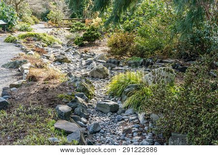 A View Of A Dry Rocky Creek Bed In Seatac, Washington.