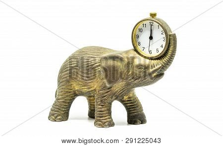 Isolated Bronze Anticue Elephant With A Clock On A White Background