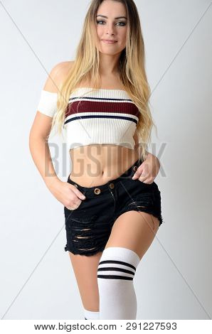 Fit Girl From Poland With Uncovered Belly. Young Female Model With Great Shape Wearing White Top, Bl