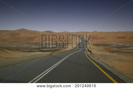 Asphalt Road In The Middle Of The Desert
