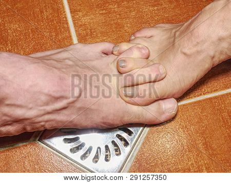 Feet Of Girlfriend  And Boyfriend Together In Tilled Shower Stall. Modern Design Of Bathroom.