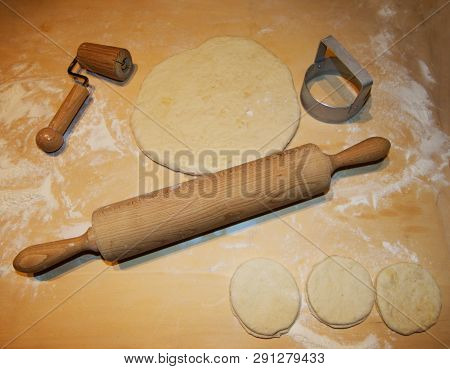Italian Tigelle Ready To Be Cooked On A Wooden Table