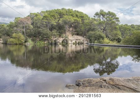 Small Lake In Terrassa, Barcelona, Spain In A Cloudy Day.