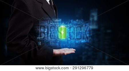 Elegant hand holding battery with full of energy