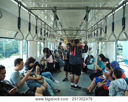 Jakarta, Indonesia - March 23, 2019: Passengers On The Train Of Mrt Jakarta At Lebak Bulus Mrt Stati