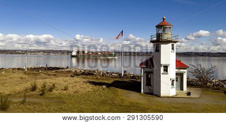 A Container Ship Passes Point Robinson In The Sound Headed For The Port Of Tacoma