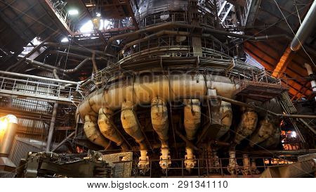 Close Up For The Blast Furnace With Liquid Steel Inside, Heavy Industry Concept. Machinery And Worke