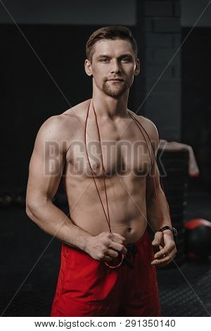 Vertical Shot Portrait Of Young Handsome Shirtless Athlete At The Gym Wear Red Shorts With Jumping R