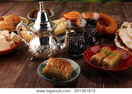 Middle Eastern Or Arabic Dishes And Assorted Meze, Concrete Rustic Background. Turkish Bread Or Turk