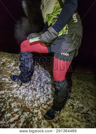 Female Runner Reading Map And Check Possition, Orienteering Cup Race.  January 25th 2019, Novy Bor, 