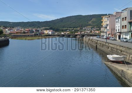 Bridge On The Traba River Before Flowing Into The Ria In Noya. Nature, Architecture, History, Street