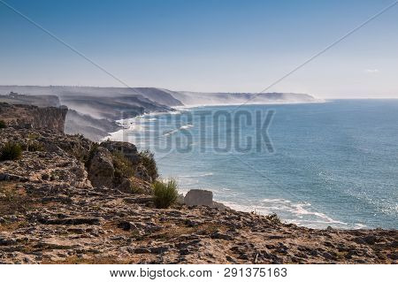 View From Edge Of A Cliff On The Other Cliffs, Partly Hidden In A Mist During A High Tide. Blue Autu