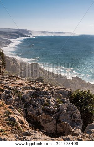 View From Edge Of A Cliff On The Other Cliffs, Partly Hidden In A Mist During A High Tide. Blue Autu