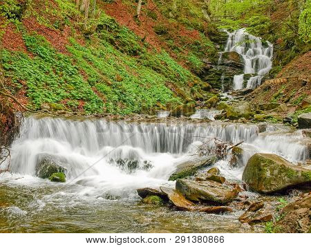Multi-level Water Cascade Of Waterfall Shypit In Beech Forest In The Carpathian Mountains Near The V