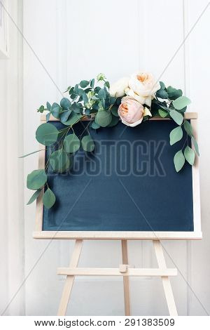 Empty Wedding Chalkboard Sign Mockup Scene. Floral Garland Of Eucalyptus Branches And Apricot Englis
