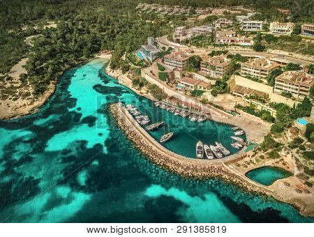 Beautiful birdeye view on the sea coastline with pier and yakhts at sunny day. Travell, jorney,islands, Seascape, freedom, holidays concept.