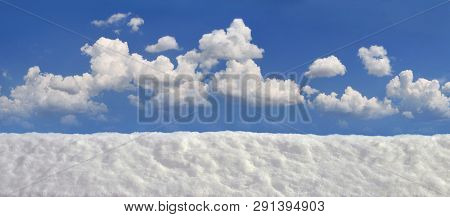 Panorama Snowdrift White Snow Against The Blue Sky With Clouds