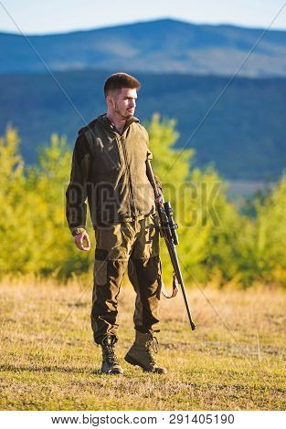 Mental Preparation For Hunting Individual Process. Man Rifle For Hunt. Hunter Khaki Clothes Ready To