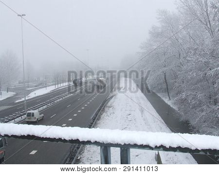 Motor Highway In The Dutch Town Of Vlaardingen Covered In Snow, Winter Landscape.