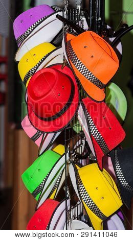 A Colorful Hat Rack At A Market