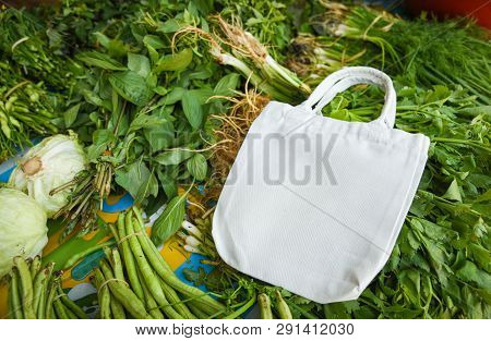 Zero Waste Use Less Plastic Concept / Fresh Vegetables Organic And Eco Cotton Fabric Bags - White To