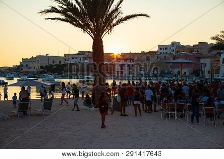 Lampedusa, Italy - August, 01: People In The Beach Bar At The Sunset On August 01, 2018