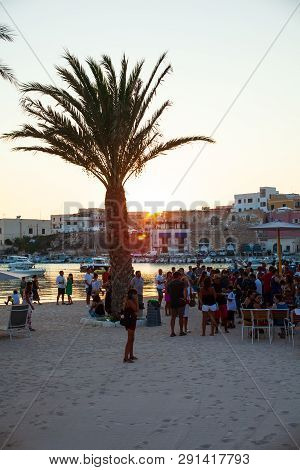 Lampedusa, Italy - August, 01: People In The Beach Bar At The Sunset On August 01, 2018