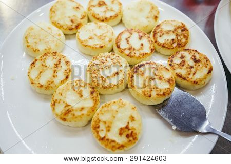 A Large Plate With Curd Cheese For Breakfast, Cottage Cheese Pancakes, Curd Fritters With Fresh Berr
